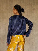 Load image into Gallery viewer, woman short jacket made in silk batik with stripes motif blue and light blue wear on top of a long silk pant yellow gold with withe floral motif