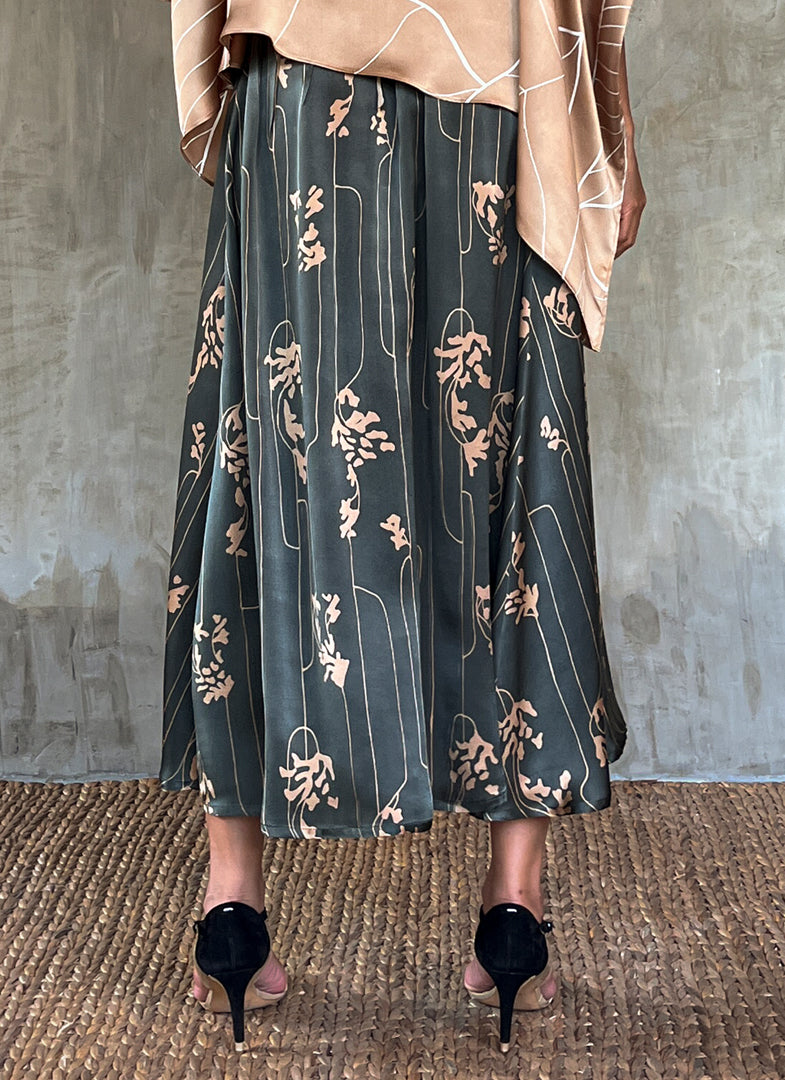 Back detail: Quarzia Aline Skirt, flowing curved hemline gathered panel across the back -delicate hand painted motif handcrafted from premium silk-Lost Grey-crafted by artisans made in Bali