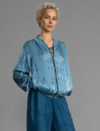 The classic Bomber Jacket reimagined in soft rayon batik. This cool jacket features elasticated cuffs at the wrists and hem for a secure, tailored fit. 