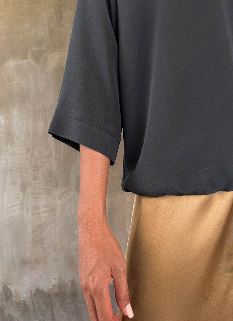 woman silk crepe top long sleeves plain grey wear on a skirt biscotto color
