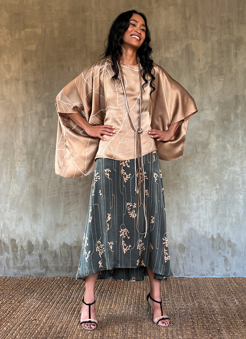square silk woman top decorated with a floreal pattern batik made in Bali and silk mid long skirt dark grey