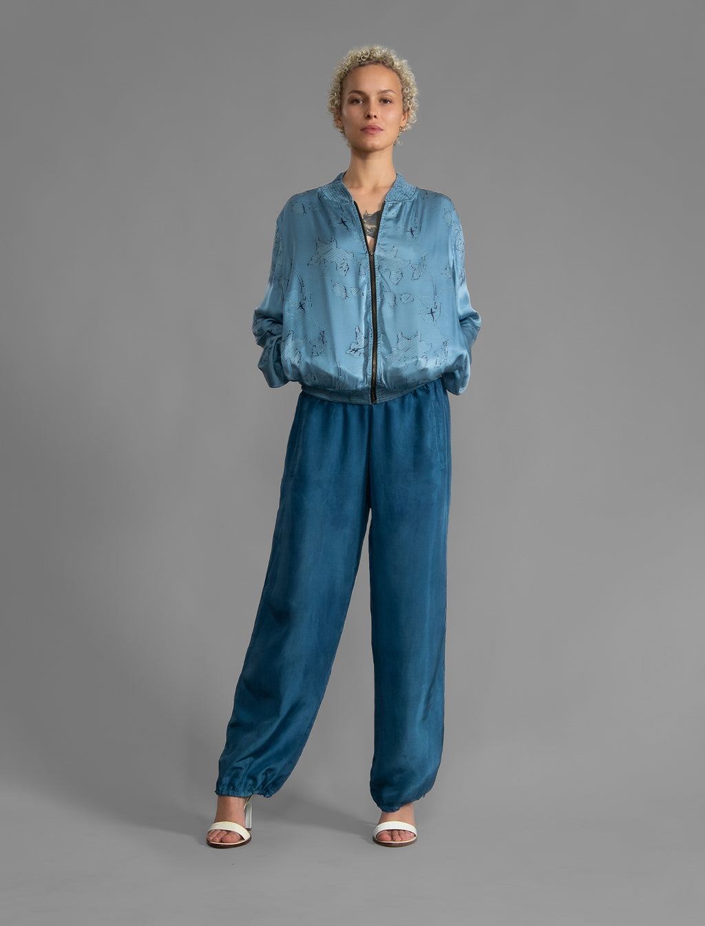 The classic Bomber Jacket reimagined in soft rayon batik. This cool jacket features elasticated cuffs at the wrists and hem for a secure, tailored fit. 