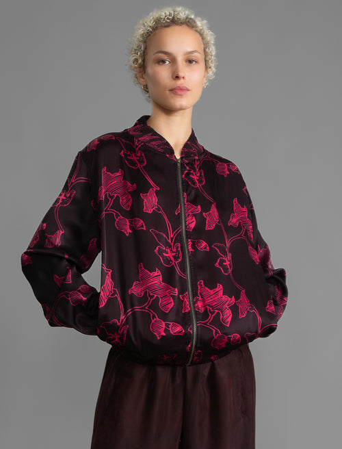 Front: The classic Bomber Jacket reimagined in soft rayon batik. This cool jacket features elasticated cuffs at the wrists and hem for a secure, tailored fit. 