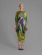 Front view with belt. Elegant silk kaftan dress with oversized pink floral batik motif on deep vino color silk, featuring flowing kimono sleeves, asymmetrical hemline, and relaxed contemporary silhouette.