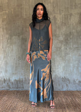 Load image into Gallery viewer, sleeveless silk top grey on a long silk dress with leaf batik decoration
