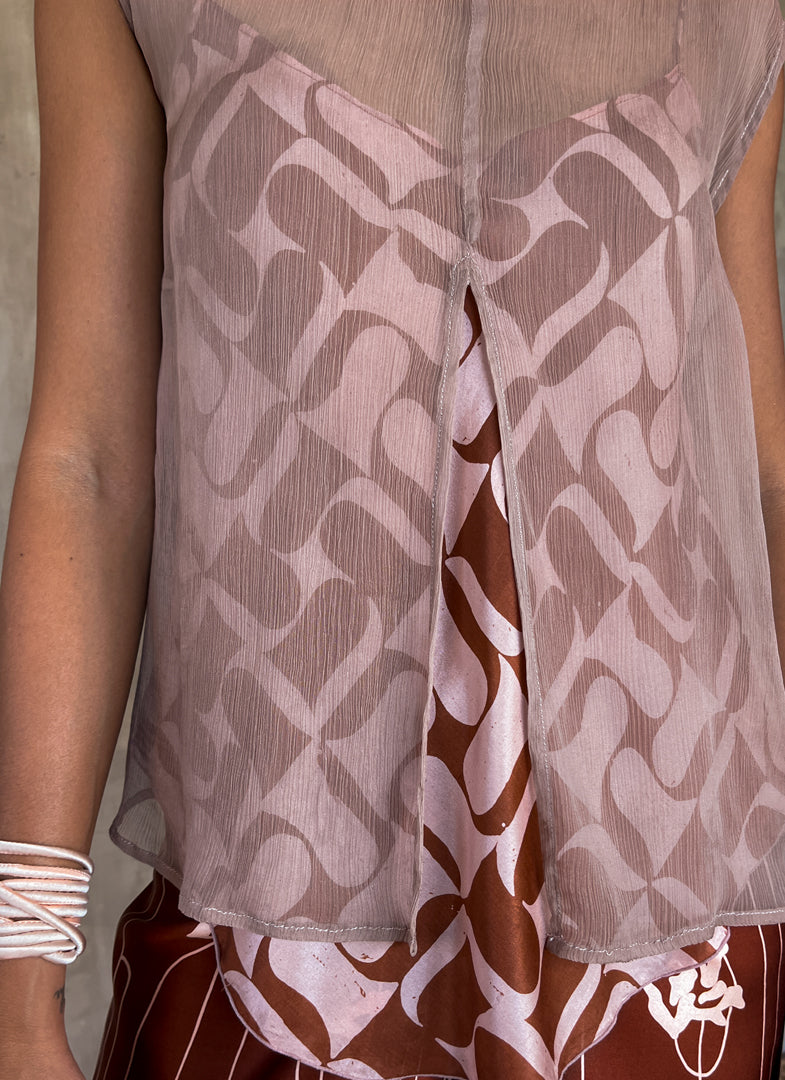 sleeveless silk crepe top pink color on top of a silk satin pant color rusty with batik decoration made in Bali