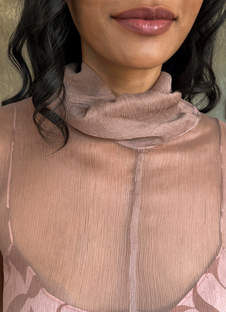 close up sleeveless silk crepe top pink color on top of a silk satin pant color rusty with batik decoration made in Bali