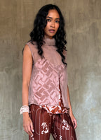 sleeveless silk crepe top pink color on top of a silk satin pant color rusty with batik decoration made in Bali
