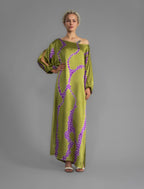 Front view without belt. Full length 100% silk tunic dress with purple macrosnake motif on moss green colour, featuring a open, wide neckline and one side split on the skirt, gathered 3/4 length sleeves with a slash opening and optional ribbon belt.