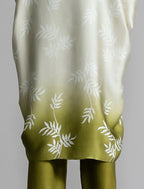 Motif detail: Relaxed flowing silk kaftan with subtle Dedaun leaf motif in moss green and white colour, featuring 3/4 length sleeves and a voluminous silhouette.