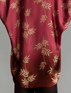 Motif detail: Relaxed flowing silk kaftan with subtle Dedaun leaf motif in russet and raspberry colour, featuring 3/4 length sleeves and a voluminous silhouette.