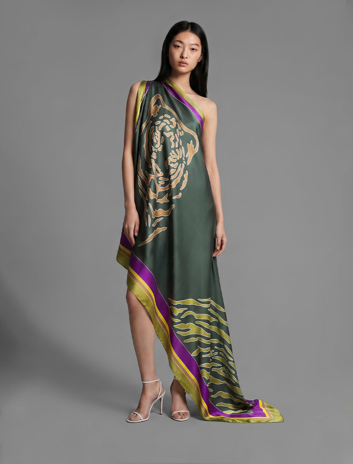 Silk hand-crafted, hand-painted batik sarong in forest green colour with gold tight and lime green zebra motif.