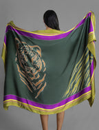 Detail View. Silk hand-crafted, hand-painted batik sarong in forest green colour with gold tight and lime green zebra motif.