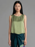 Close front view. Front view. 100% silk short length stretch singlet in fern green colour with open neckline and wide shoulder straps.
 