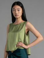 Side view. Front view. 100% silk short length stretch singlet in fern green colour with open neckline and wide shoulder straps.
 
