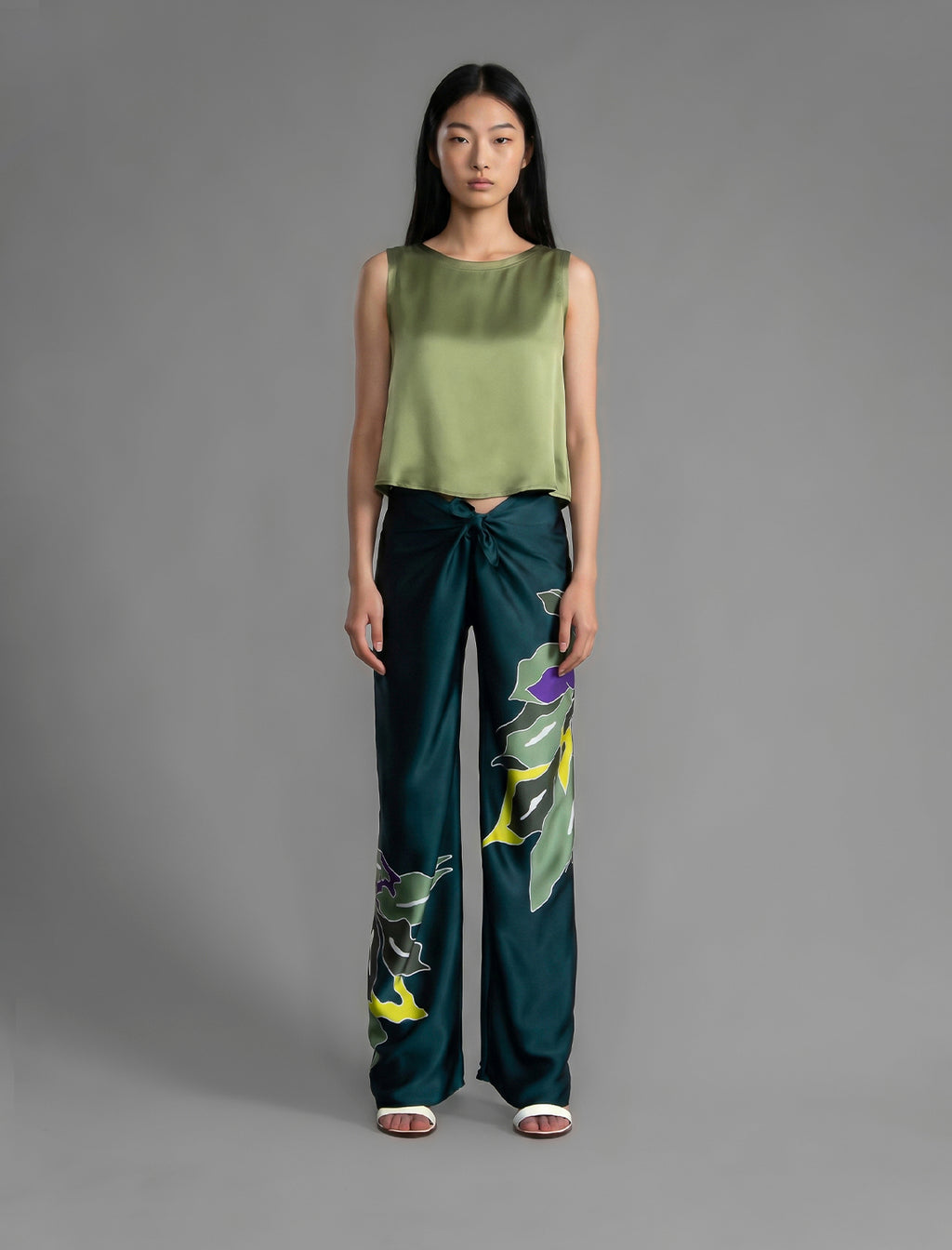 Front view. Front view. 100% silk short length stretch singlet in fern green colour with open neckline and wide shoulder straps.