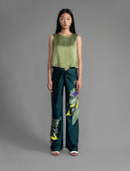 Front view. Front view. 100% silk short length stretch singlet in fern green colour with open neckline and wide shoulder straps.