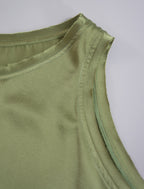 Detail view. Front view. 100% silk short length stretch singlet in fern green colour with open neckline and wide shoulder straps.