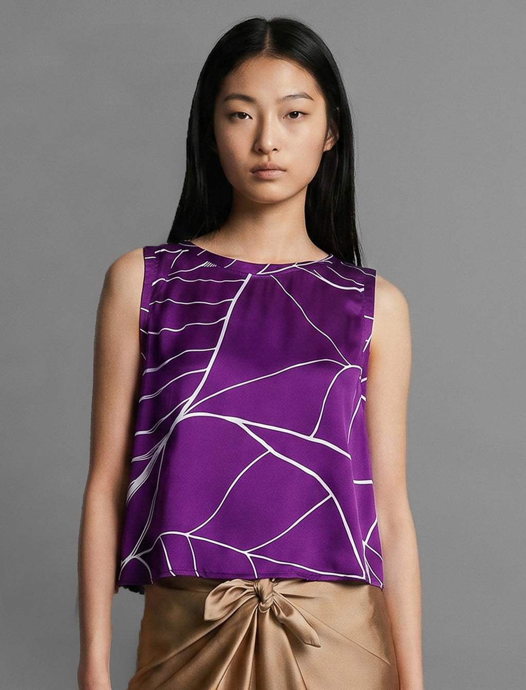 Front view. 100% silk short length stretch singlet with linear leaf motif on purple colour with open neckline and wide shoulder straps.