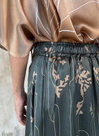 Elasticated waist detail back: Quarzia Aline Skirt, flowing curved hemline gathered panel across the back -delicate hand painted motif handcrafted from premium silk-Lost Grey-crafted by artisans made in Bali