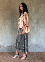Side detail: Quarzia Aline Skirt, flowing curved hemline gathered panel across the back -delicate hand painted motif handcrafted from premium silk-Lost Grey-crafted by artisans made in Bali