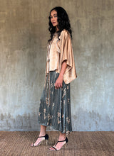 Load image into Gallery viewer, Side detail: Quarzia Aline Skirt, flowing curved hemline gathered panel across the back -delicate hand painted motif handcrafted from premium silk-Lost Grey-crafted by artisans made in Bali
