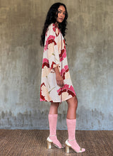Load image into Gallery viewer, Side detail -Handpainted silk batik dress with Ginkgo pattern, multicolor, kneelenght, a-line silhouette, trumpet sleeves.

