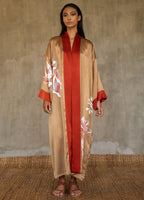 Quarzia signature Kimono has wide, flowing sleeves and it's handcrafted from pure silk satin. As Japanese style' kimono  it is open under the arms, and there's a bold border in contrast color on the cuffs and on the front. A beautiful silk belt also in contrast color frame this elegant piece, ultimate in relaxed style, elegance and comfort. The batik pattern is inspired by  flower and leaves. 
