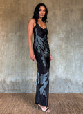 Silk satin handcrafted long spaghetti dress in black with maxi foliage pattern front and back. Bias cut dress with low V-neckline.