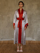 Load image into Gallery viewer, Quarzia signature Kimono has wide, flowing sleeves and it&#39;s handcrafted from pure silk satin. As Japanese style&#39; kimono  it is open under the arms. A bold contrast color border on the cuffs and on the front, together with the same color silk belt, frame this elegant piece, ultimate in relaxed style, elegance and comfort. The batik pattern is inspired by the beauty of imperfection in nature.
