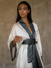 Load image into Gallery viewer, Top front detail: Quarzia signature Kimono has wide, flowing sleeves and it&#39;s handcrafted from pure silk satin. As Japanese style&#39; kimono  it is open under the arms, and there&#39;s a bold border on the cuffs and on the front. A beautiful silk belt frame this elegant piece, ultimate in relaxed style, elegance and comfort. The batik pattern is inspired by Kintsugi Japanese technique to fix the broken ceramics.
