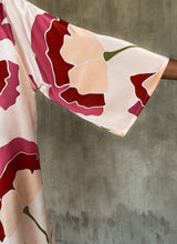 Load image into Gallery viewer, Detail of trumpet sleeve of Bella dress Ginkgo25, in pink color.
