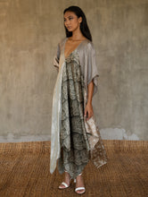 Load image into Gallery viewer, The  silk satin grey Ally dress is a celebration of modern batik patterns. Multiple designs, inspired by nature, are hand-crafted on silk in various hues of grey. The generous silhouette will suite all sizes.
