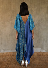 Load image into Gallery viewer, Back detail: the  silk satin blue Ally dress is a celebration of modern batik patterns. Multiple designs, inspired by nature, are hand-crafted on silk in various hues of blue. The generous silhouette will suite all sizes.
