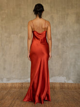 Load image into Gallery viewer, Back detail: this full length slip dress is cut on the bias, allowing a natural drape on the body which is complimented by the delicate spaghetti straps and the gentle, low-cut V-neckline. 
