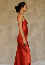 Load image into Gallery viewer, Side detail: this full length slip dress is cut on the bias, allowing a natural drape on the body which is complimented by the delicate spaghetti straps and the gentle, low-cut V-neckline. 
