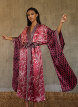 Load image into Gallery viewer, Quarzia&#39;s closest take on japanese Kimono&#39; style, glossy batik patterned silk satin with &quot;Furisode&quot; long-hanging sleeves. Formal robe in graphic floral patterns, in pink/white/black colors. Cuffs, front border and belt all in contrast pattern define this timeless piece. 
