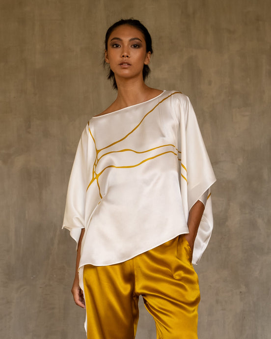 square silk satin top batik decorated in white and gold color with a yellow gol silk pant