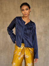Load image into Gallery viewer, woman short jacket made in silk batik with stripes motif blue and light blue wear on top of a long silk pant yellow gold with withe floral motif
