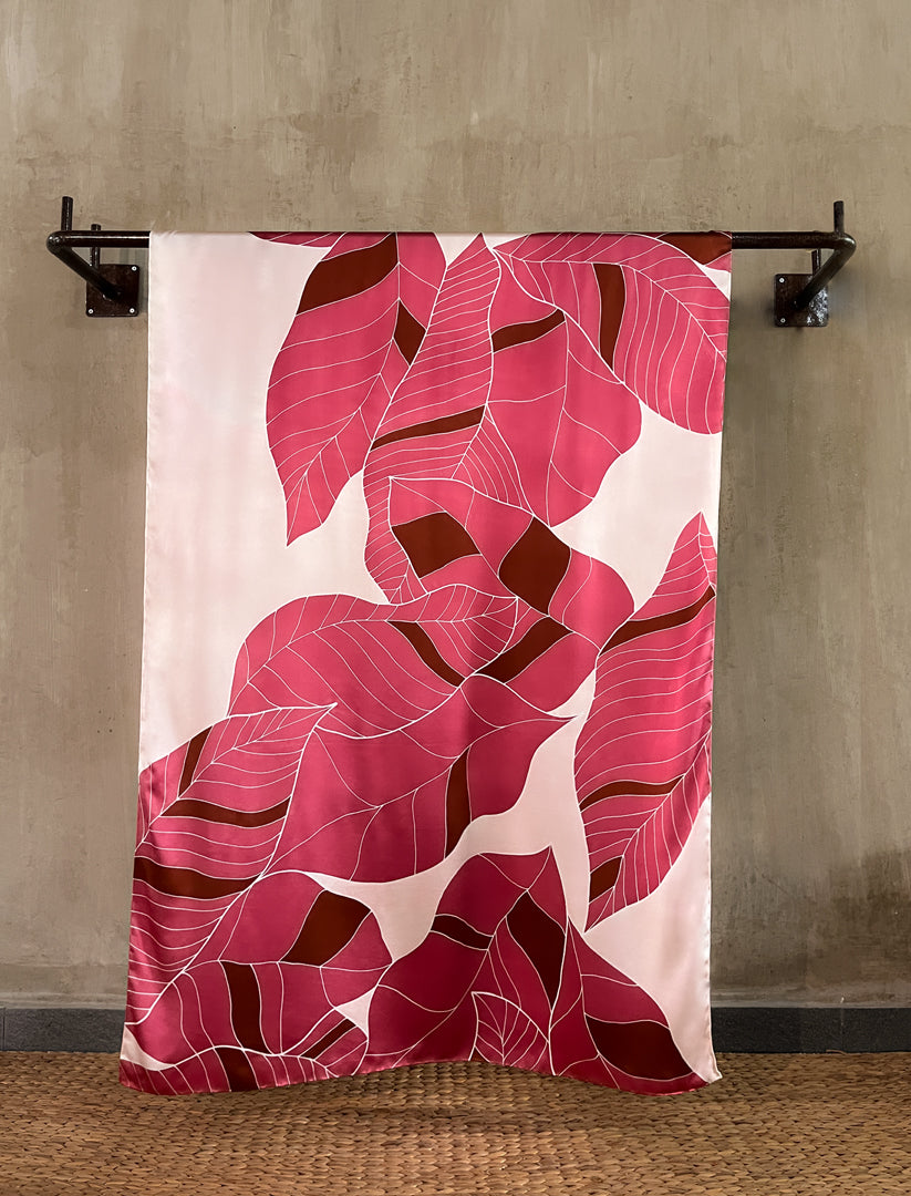 handcrafted silk batik sarong with tropical leaf pattern in pink and red coral color