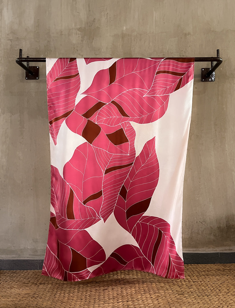 handcrafted silk batik sarong with tropical leaf pattern in pink and red coral color