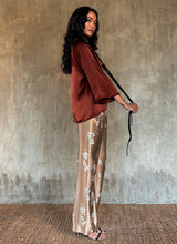Load image into Gallery viewer, woman rust colored silk top and silk long pant biscotti color handmade batik in Bali
