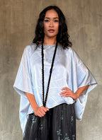 woman silk satin top hand painted in Bali in batik floreal style and dark grey skirt