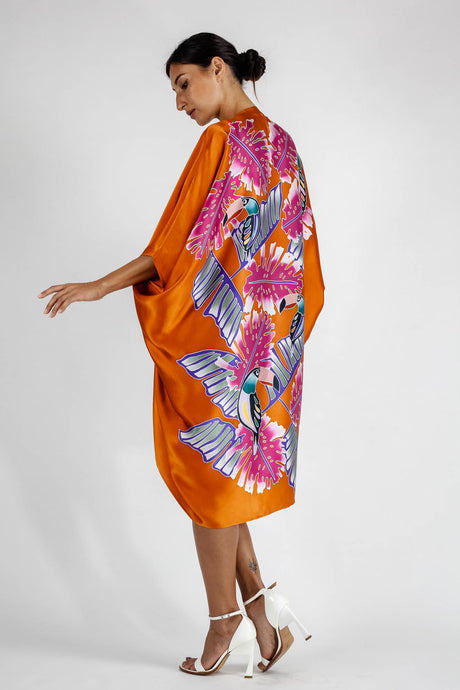 Quarzia luxury decorative Open Kaftan with three-quarter length sleeves-hand painted tropical motif handcrafted from premium silk-Tuki Burnt Orange-crafted by artisans in Bali
