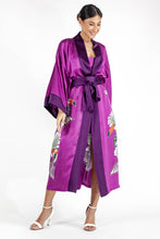 Load image into Gallery viewer, Front detail: Quarzia signature Kimono has wide, flowing sleeves and it&#39;s handcrafted from pure silk satin. As Japanese style&#39; kimono  it is open under the arms. A bold contrast color border on the cuffs and on the front, together with the same color silk belt, frame this elegant piece, ultimate in relaxed style, elegance and comfort. The batik pattern is inspired by the incredible balinese leafy jungle and colorful tucans beauty.
