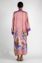 Load image into Gallery viewer, Back detail: Quarzia signature Kimono has wide, flowing sleeves and it&#39;s handcrafted from pure silk satin. As Japanese style&#39; kimono  it is open under the arms. A bold contrast color border on the cuffs and on the front, together with the same color silk belt, frame this elegant piece, ultimate in relaxed style, elegance and comfort. The batik pattern is inspired by the incredible balinese leafy jungle and colorful tucans beauty.
